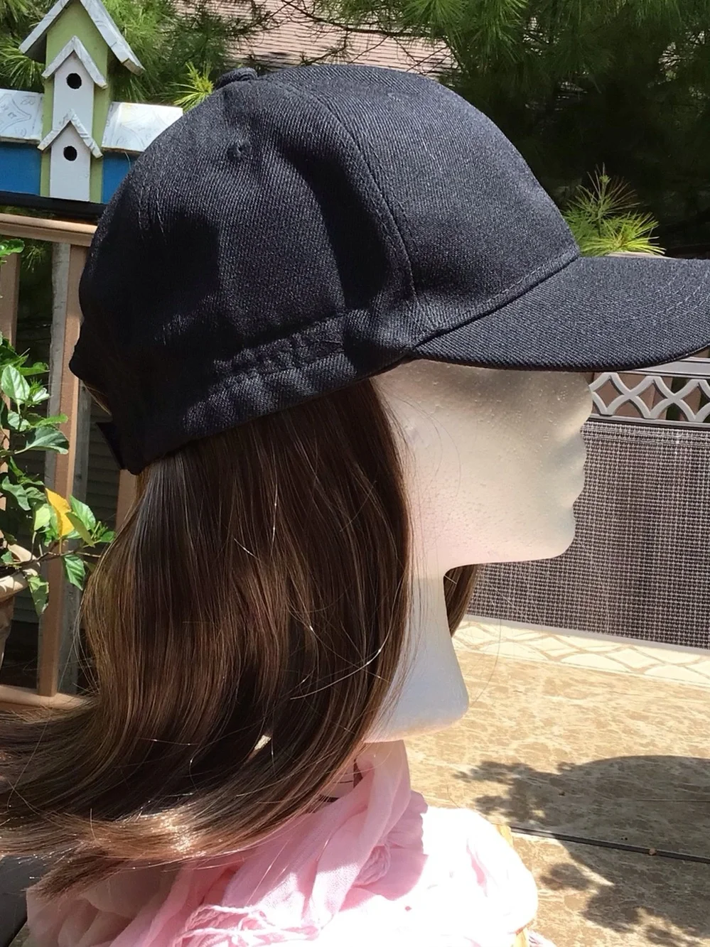 Black baseball cap with brown/blonde highlights attached wig